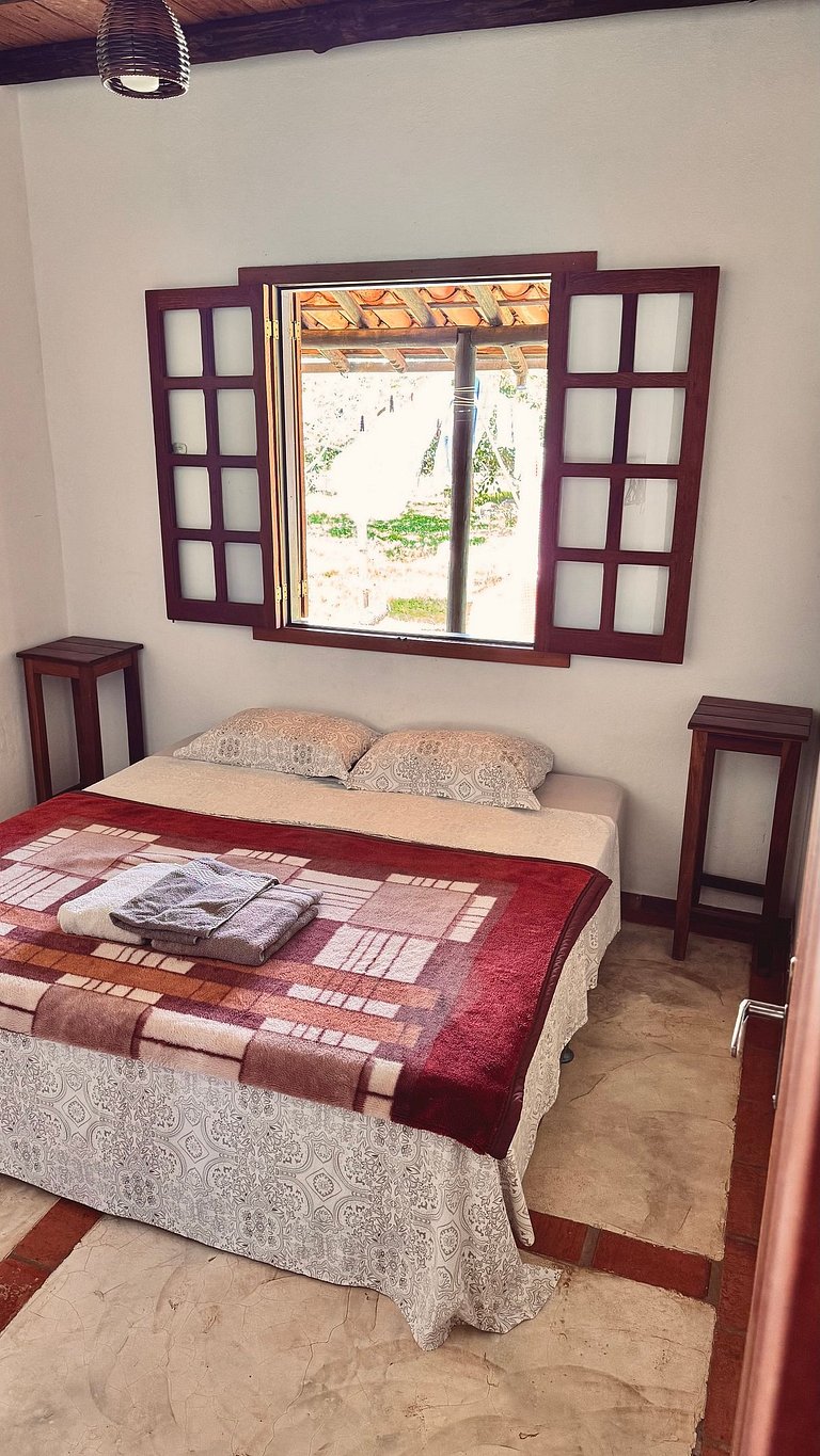 Quarto aconchegante em linda casa com jardim