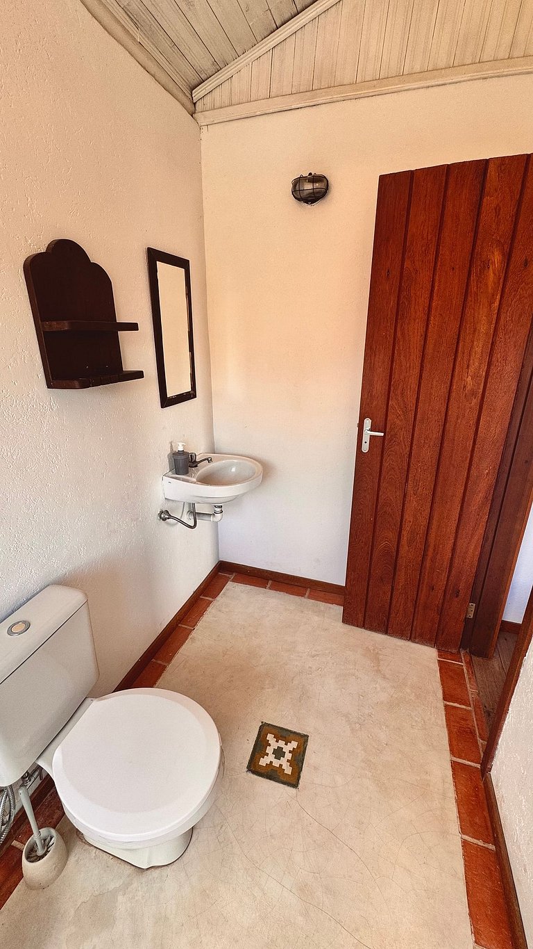 Casa charmosa com chalés, jardim e área gramada